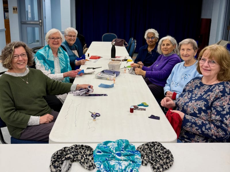 Ladies group stitches comfort, one chemotherapy cap at a time