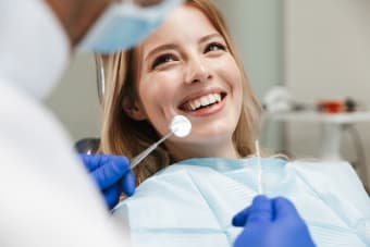 How often should I visit the dentist and why?